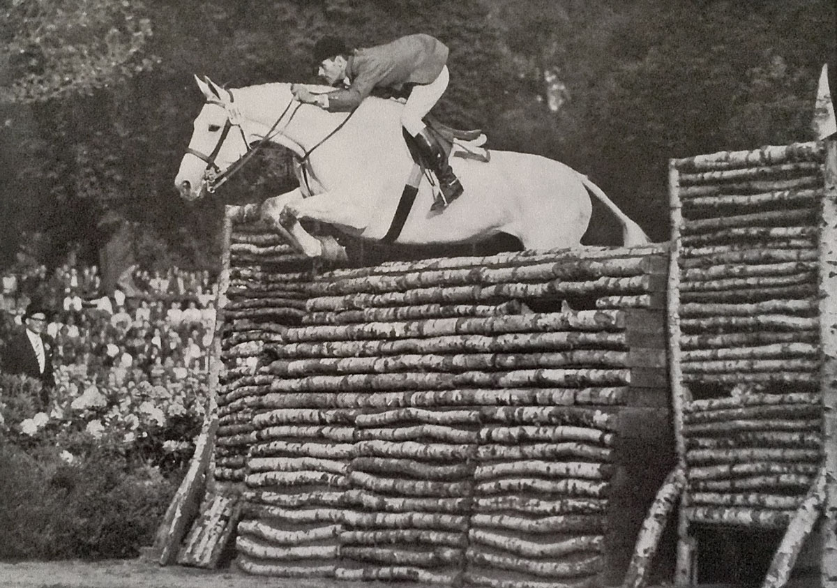 Steinkraus and Ksar dEsprit jumping a 7-foot puissance wall